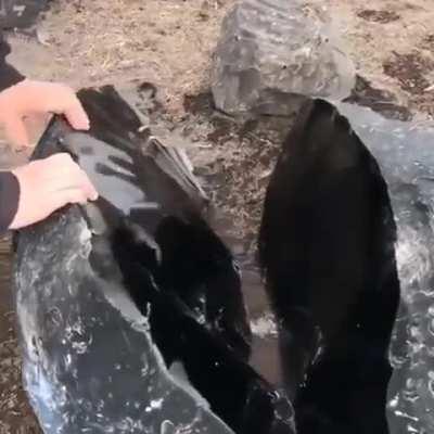 An enormous obsidian stone split in half