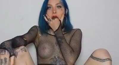 Blue Hair Light Blue Eyes Many Tatoos And A Puking Smile