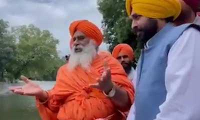 Indian minister drinks dirty water from 'holy' river polluted with sewage to show locals it's safe... ends up in hospital days later