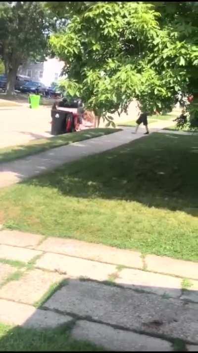 White people ambush black man walking down the street.