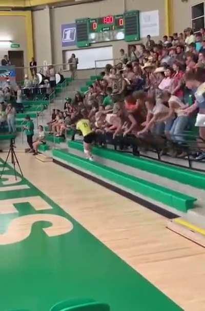 The railing supports didn't support the weight of the supporters at this 2019 volleyball game