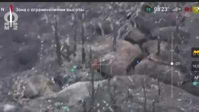 Kamikaze FPV drone pilot flies around a dugout to find the best point of entry