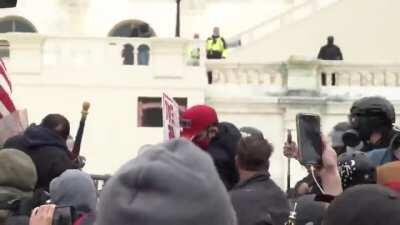 #SuitMacer unmasked. He sprayed some kind of pepper spray on many police officers.