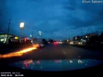 A truck's tire pops while driving at night