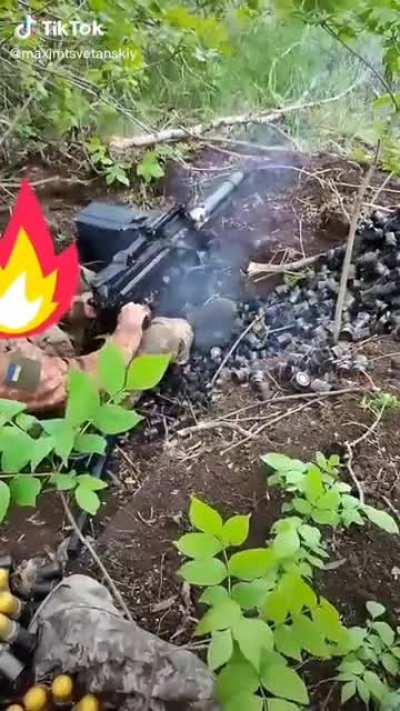 Ukrainian UAG-40 firing NATO standard 40x53mm grenades at Russian troops.