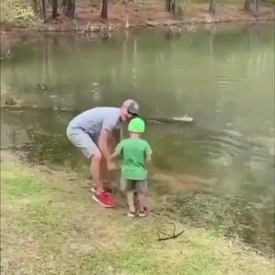 Little kid bringing in a huge fish