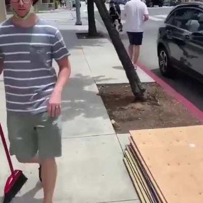 Santa Monica woman pretends to board up windows using a worker's drill for a photo then drives off in a Mercedes.