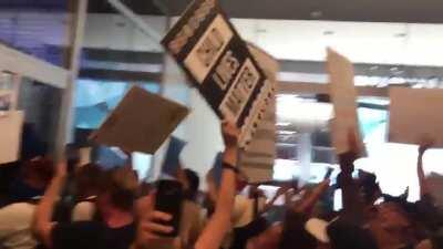 QAnon protestors inside CNN building in Hollywood chanting 