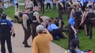 Shocking footage shows several officers at Washington University St. Louis beating a professor, slamming him, and dragging his limp body.
SIUE history professor Steve Tamari is reportedly hospitalized with broken ribs and a broken hand.
One doctor told hi