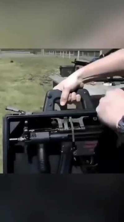 A modified suitcase allows a person to fire a concealed MP5