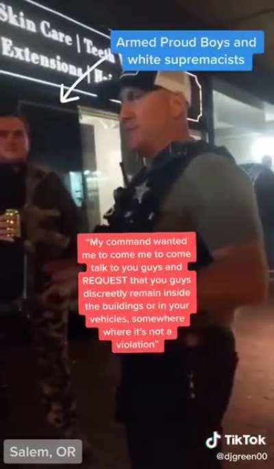 POLICE OFFICER TELLS PROUD BOYS TO HIDE INSIDE BUILDING BECAUSE THEY'RE ABOUT TO TEAR GAS PROTESTERS. THE OFFICER SAID HE WAS WARNING THEM 