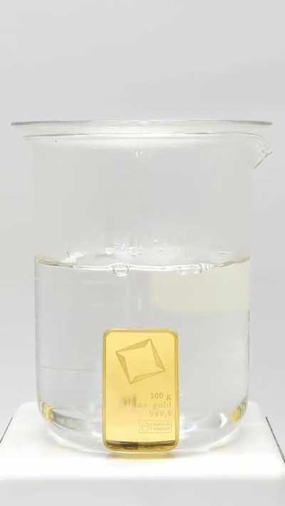 Dissolving a pure gold bar in acid..