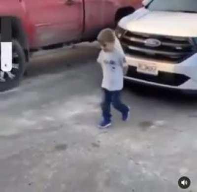 Excited kid rams head into garage door