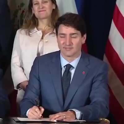 Trump signing the wrong location on Canada's copy of CUSMA in 2018