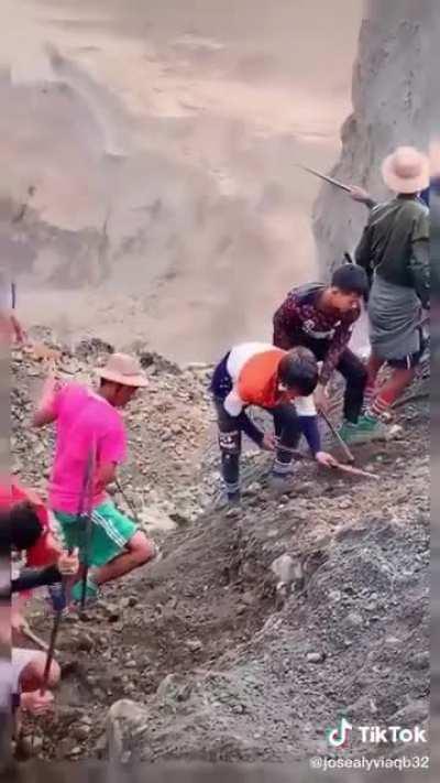 Locals in Myanmar looking for Jade at a quarry