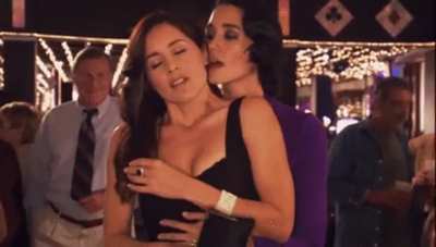 Sandrine Holt licking a chick