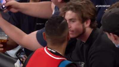 Nick Kyrgios getting around the beers with a fan