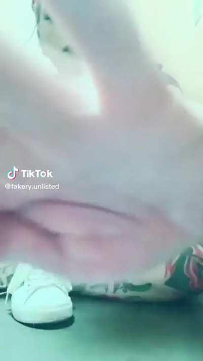 Nothing like showing off tats on a public restroom floor