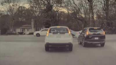 Of course the driver of the black car got pissed at the other driver for... hitting them?