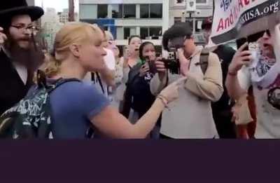 Israeli woman shouting at anti-zionist jews.