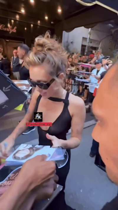 Miley autographing in NYC.