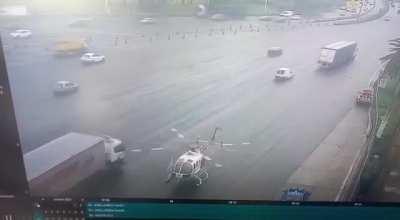 The helicopters was evacuating an injured driver from a previous crash, those cars/trucks were jumping roadblock because the didn't want to wait.