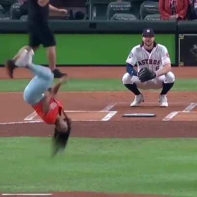 Girl throws a baseball