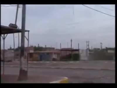 US Marines firing an M-203 grenade launcher at an abandoned car in Fallujah, Iraq (2004)