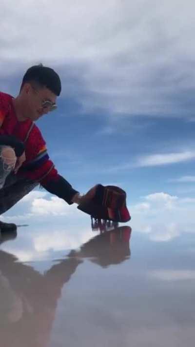 Dude catches some little munchkins on the beach.