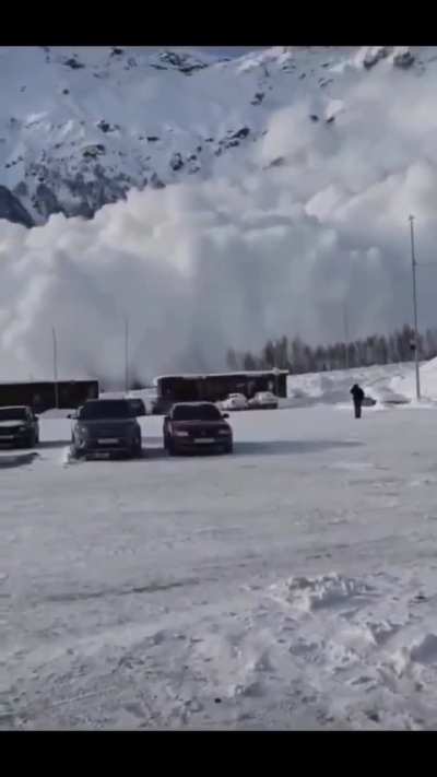 Russians watch avalanche barrel at them in Mount Elbrus resort