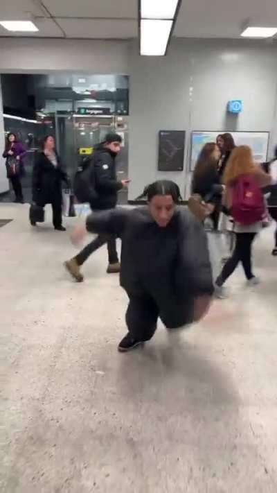 Absolute unit of an idiot getting in the way of everyone in the metro