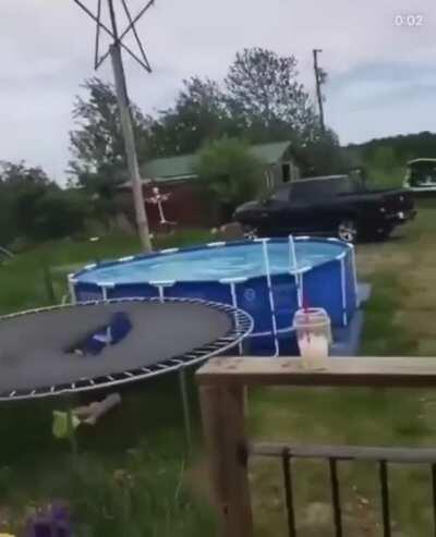 Insane rooftop jump into a pool.