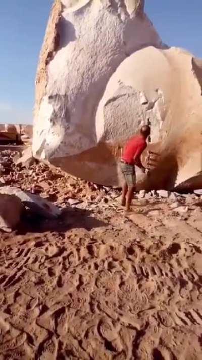 Splitting open a huge rock