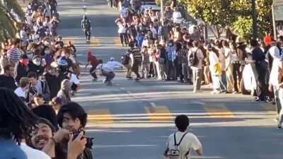 painting the asphalt with his bare ass