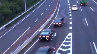 The Japanese Prime Minister's Motorcade merges into traffic