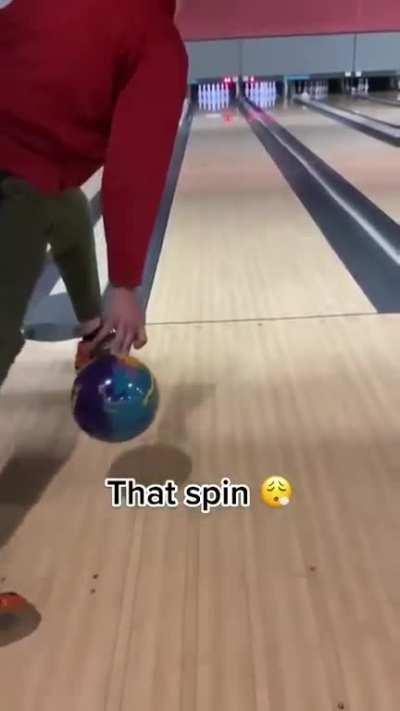 Man puts very impressive spin on bowling ball for a strike. There, is that title descriptive enough mods?