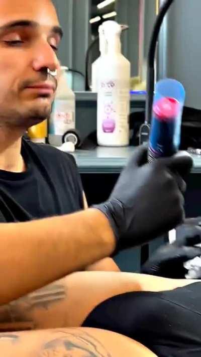 Tattoo artist just doing his job