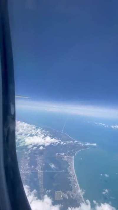 Atlas V rocket launch from a plane window (Credit: Mathew Palmer)