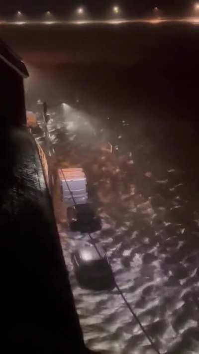 People who park their cars near the shore during Red Warning Storm. (The Long Walk - Galway).