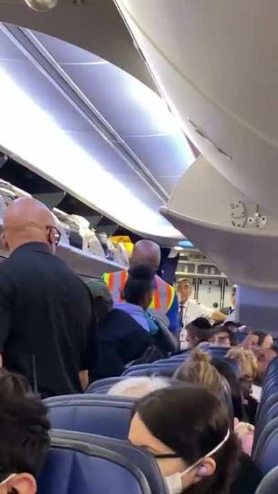 Trashy family gets kicked off the plane. Proceeds to slap me on the way out. Me and 7 of my friends missed our connection flight because of this nonsense.
