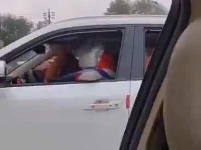 Pulling up next to Ted, Pikachu and... who's that driving?