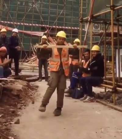 Construction worker showing his dancing skills