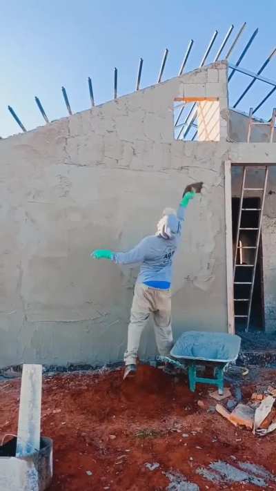 How this worker throws mortar onto a wall