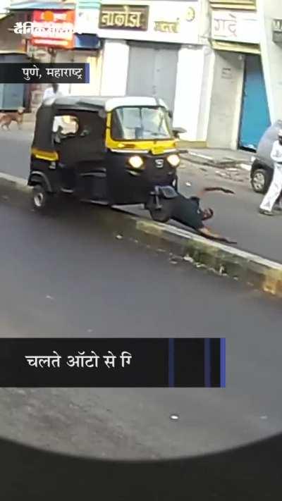 Man in tuktuk driving rashly decides to kick a dog on the street while speeding, doesn't end well for him (Injured, but alive) [Pune, India]