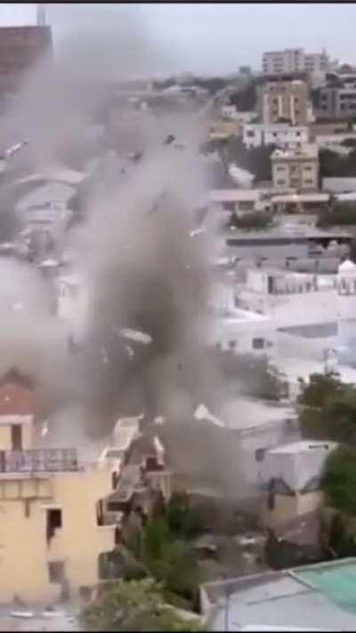 Somali security forces use heavy explosives to destroy a section of the Hayat Hotel in Mogadishu yesterday. The top floor of the hotel was seized by al-Shabaab militants for over 18 hours.