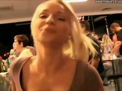 Super hottie drinking beer and flashing in a bar