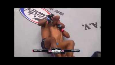 Demetrious Johnson ducks Rodtang's left hook, takes his back