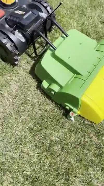 I modified this John Deere toy sweeper, and now my Landroid not only lawns but sweeps automatically too.