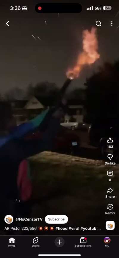 Gangbangers shooting a gun off in the air in a residential neighborhood