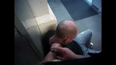 A handcuffed drunk man spits in a cop's face and is brutally kneed in the face!